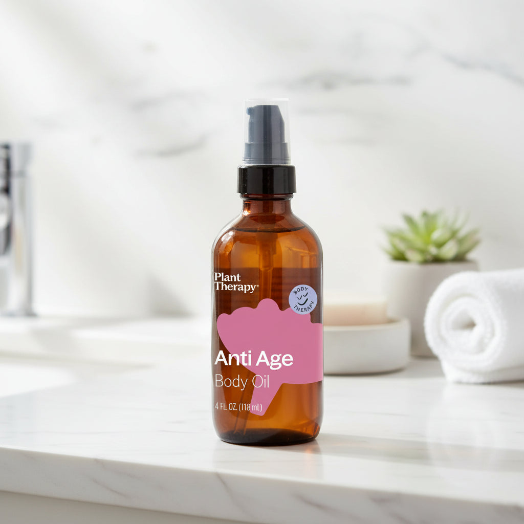 Brown glass bottle of Plant Therapy Anti Age Body Oil on a white background